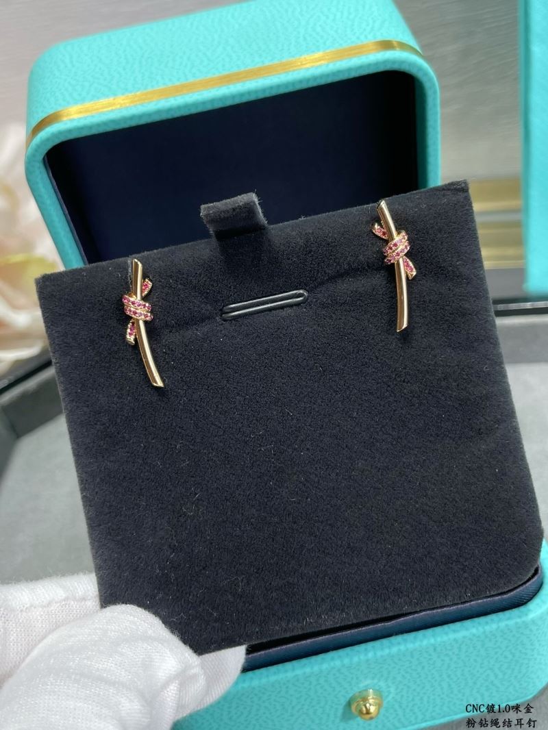 T*f*ny earrings